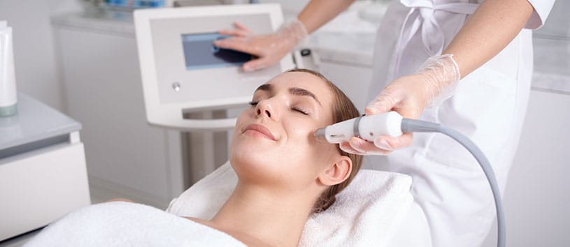 Woman receiving skin treatment.