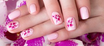 Closeup of a pink floral manicure.
