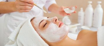 Woman receiving a facial treatment.