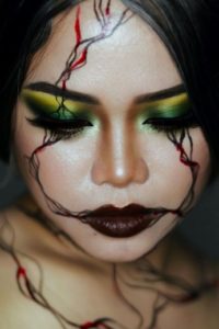 Woman wearing SFX makeup on her face.