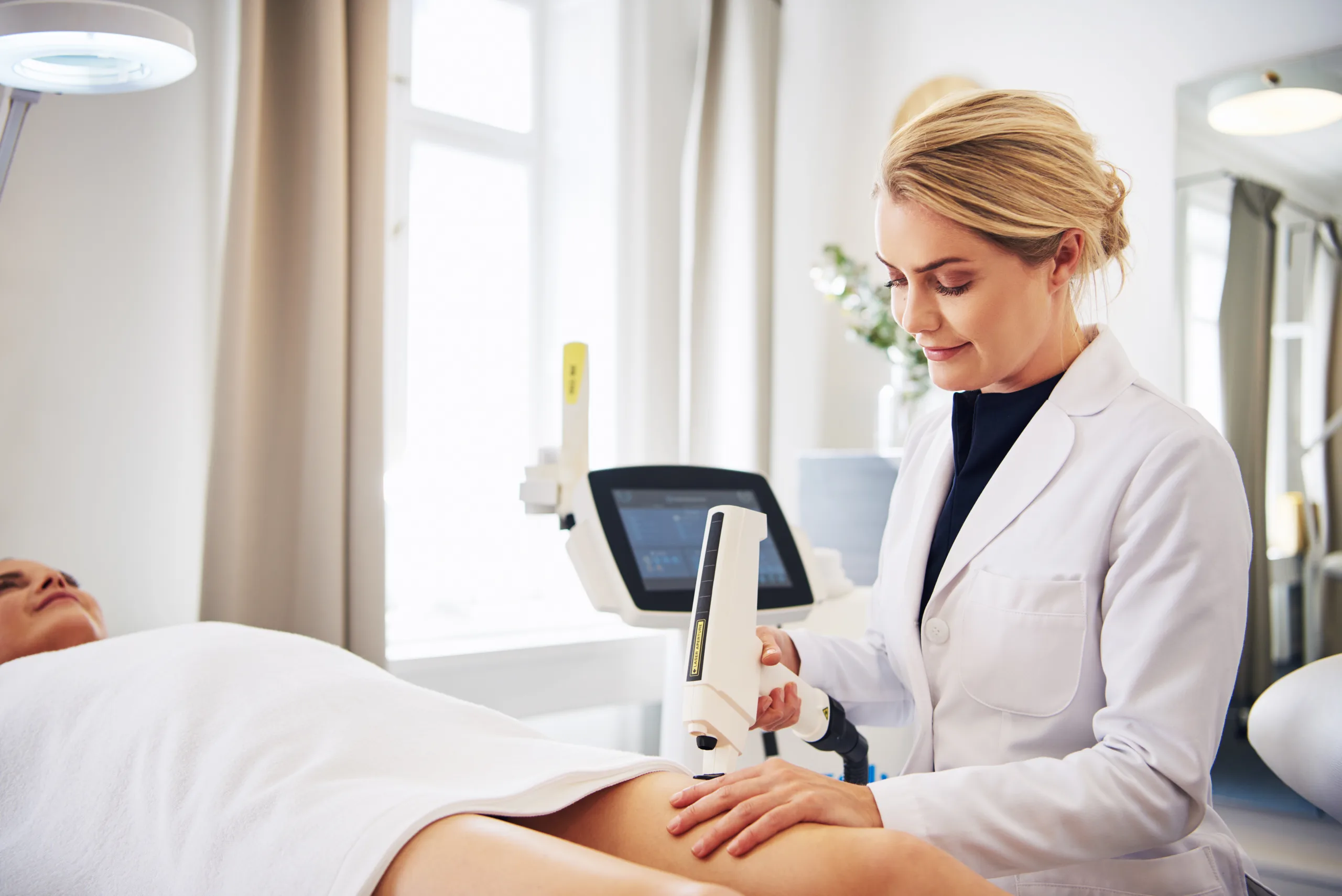 Electrolysis specialist performing treatment.
