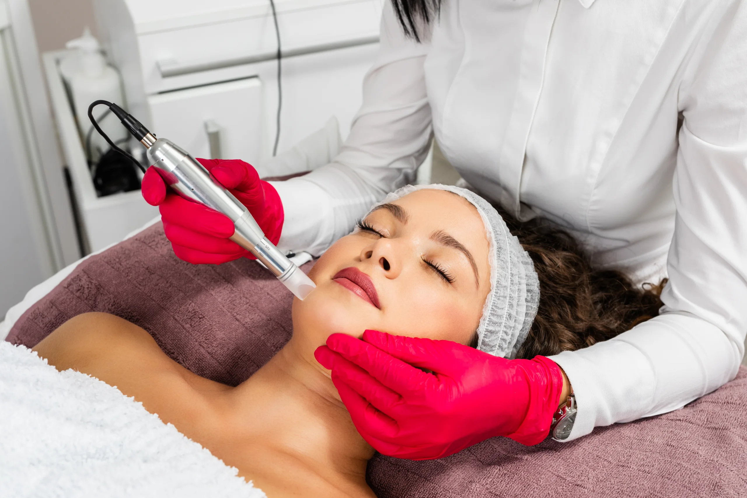 Beautiful woman receiving microneedling rejuvenation treatment. Mesotherapy.